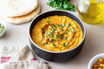 Pumpkin hummus with seeds and greens. Healthy eating. Vegetarian food.