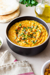 Pumpkin hummus with seeds and greens. Healthy eating. Vegetarian food.
