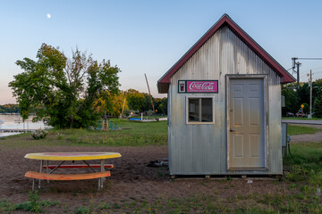 Small tin building for selling refreshments at a public beach on Ottertail Lake in Minnesota 
