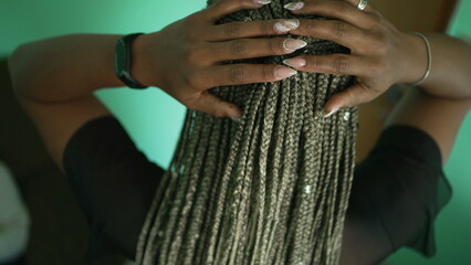 One African American girl showing her dreadlocks braided hairstyle