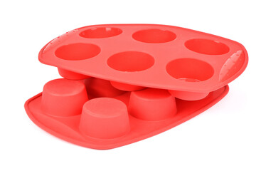Red silicone form for cooking muffin and cupcake on white background. Side view. High resolution...
