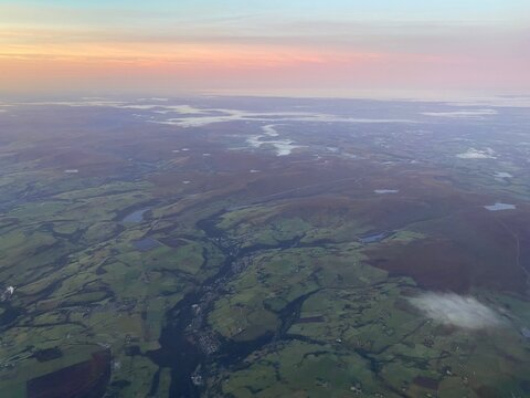 View flying over Peak District at sunrise on a foggy morning