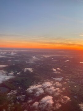 View flying over Peak District at sunrise on a foggy morning
