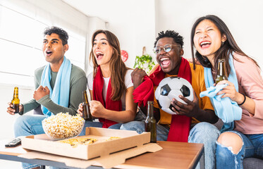 Happy friends watching soccer world cup on television at home - Football fans celebrating goal together - Sport, entertainment and friendship concept