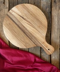 wooden cutting board on wooden background