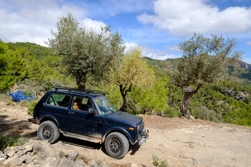 Fototapeta na wymiar Lada Niva SUV, Sa Galera olive grove, Alaro, walk around Talaia de Cals Reis, Majorca, Balearic Islands, Spain