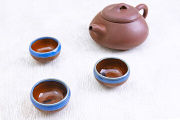 Obraz na płótnie Canvas tea set view, Chinese teapot, cups on a white background