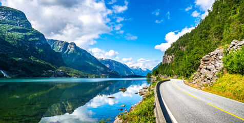 Amazing view of scandinavia nature with fjord and mountains. Beautiful reflection. Location: Scandinavian Mountains, Norway. Artistic picture. Beauty world. Panorama
