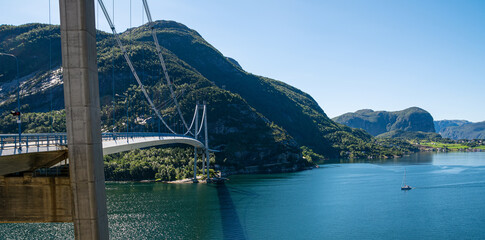 Typical Norwegian view of the bridge across the fjord. Colorful summer day in the Norway. Travel concept. Artistic picture. Beauty world