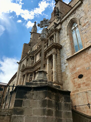 Fototapeta na wymiar Montblanc, Spain, June 2019 - A stone church with a clock on the side of a building