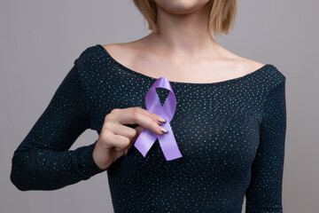 Woman holding a purple ribbon in her hands ADD,ADHD,Alzheimer Disease ,Arnold Chiari...