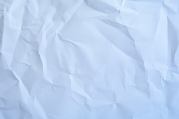 Crumpled paper in cold colors as a background.