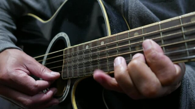 Person playing guitar. Acoustic guitar