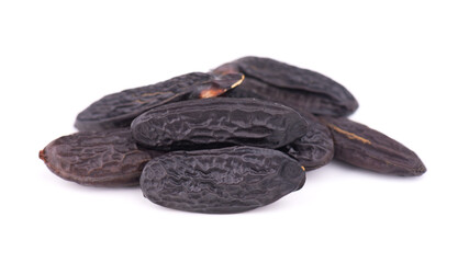 Tonka beans isolated on white background. Bean of Dipteryx odorata, cumaru or kumaru. Fresh aroma tonka beans.