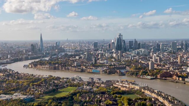 High panoramic time lapse view of the London skyline along the river Thames from London Bridge until the City during a sunny day, United Kingdom