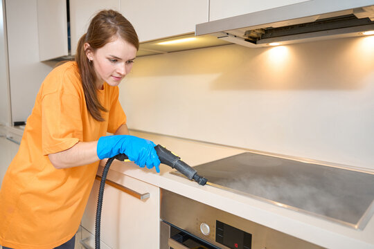 Portrait of female cleaning contaminated surfaces with instrument
