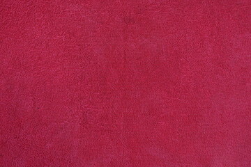 Textile and texture concept - closeup of crumpled pink fabric background, 