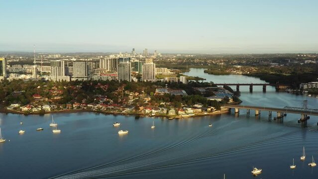 Aerial panning over Parramatta river from City of Ryde to Rhodes in 4k.
