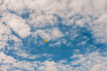 Smiley cloudy sky kite