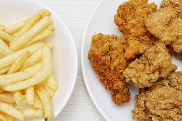 Close up of fried chicken and french fries