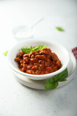 Homemade Bolognese sauce with fresh basil