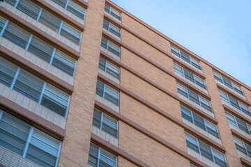 Building exterior in a low angle view with brown trims at Austin, Texas