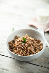 Traditional homemade buckwheat porridge in a white bowl