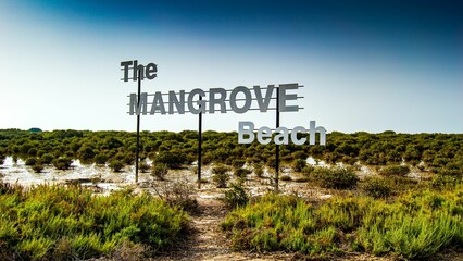 Naklejka premium Beautiful shot of The Mangrove Beach sign on a natural background, Umm Al Quwain, UAE