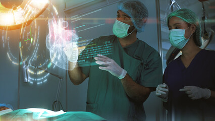 Futuristic simulation operating room - a surgeon diagnosing a senior woman's heart problem via a...
