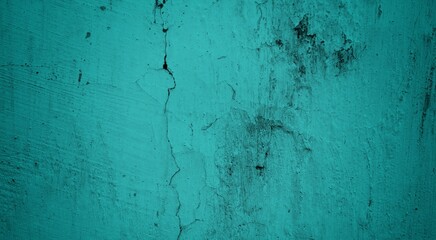 Obraz premium A textured background featuring a deep teal color with a distressed, grunge appearance. The surface shows variations in tone and subtle patterns, creating an abstract and moody aesthetic.