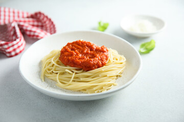 Spaghetti with tomato sauce and basil