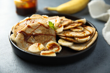 Homemade banana pancakes with caramel sauce