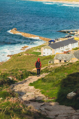 person walking on the coastal path