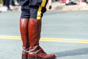 St. John's, Newfoundland, Canada: October 2022:Rearview of high brown leather boots worn by a Royal...