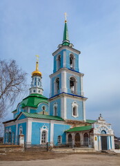 Fototapeta na wymiar The building of the Orthodox church against the blue sky in spring. Russia. Ural