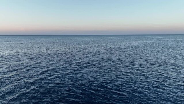 Sunrise over calm sea. Dawn over horizon,aerial view 4 K