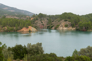 Beautiful landscape of the cortes del pallas reservoir with the mountain cuts and its grove everywhere in the Valencian community, Spain