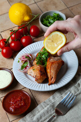 Grilled chicken kebab with vegetables and greens