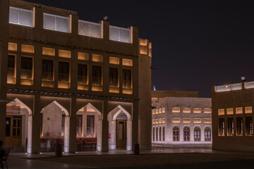 Doha, Qatar, May 5,2022: Traditional Arabian building built of wood and mud decorated with a facade in the traditional Arabic style.