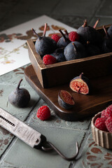 A few figs on an old wooden cutting board