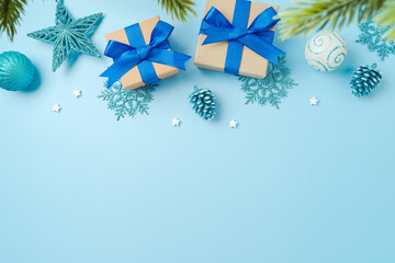 Merry Christmas background with gift boxes and blue decorations. Top view, flat lay