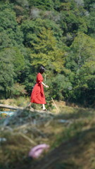 The young  Chinese couple walking on the country road with the warm sunlight