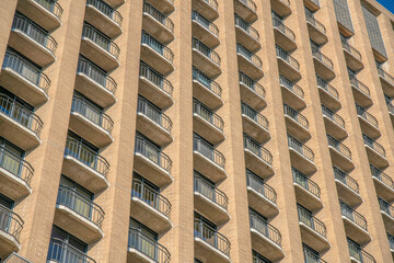 Austin, Texas- Low angle view of a multi-storey residential building with bricks and balconies
