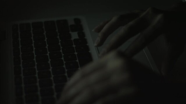 Young Woman's Hands Typing On Laptop Late at Night 4K
