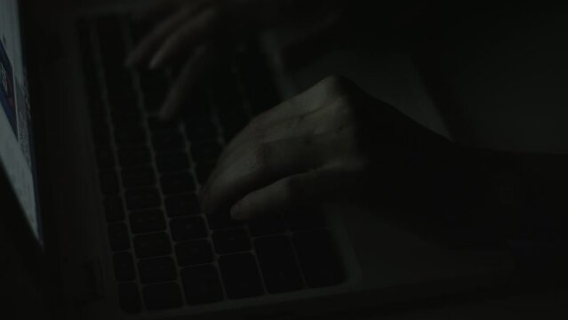 Young Woman's Hands Typing On Laptop Late at Night 4K