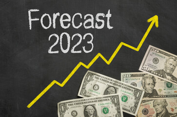  Text on blackboard with money - Forecast 2023