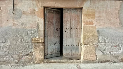 Fotobehang Oude deur rustic wooden door open on old facade
