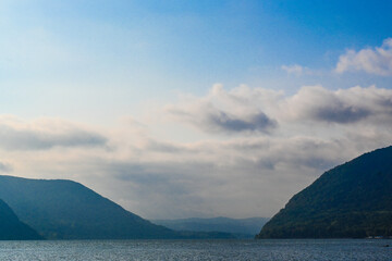 The Hudson River flows between Breakneck Ridge and Storm King Mountain in update New York state.