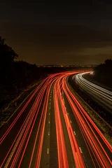 Foto op Plexiglas High angle view of nighttime traffic on motorway  © Into The Light