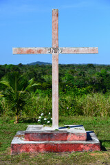 A cross at the top of a low hill in the riverside Quilombo of Pedras Negras, a settlement founded...